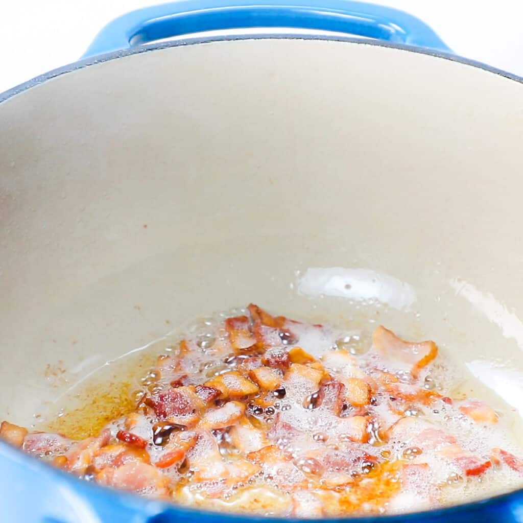 bacon cooking in a stock pot