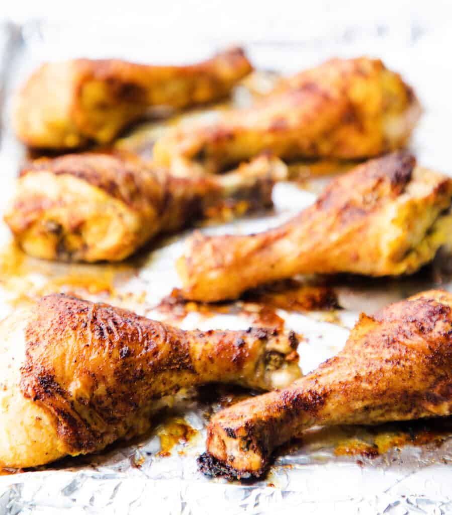 a tray of the baked chicken drumsticks fresh from the oven