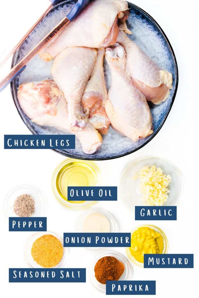 all of the ingredients for baked chicken legs laid
