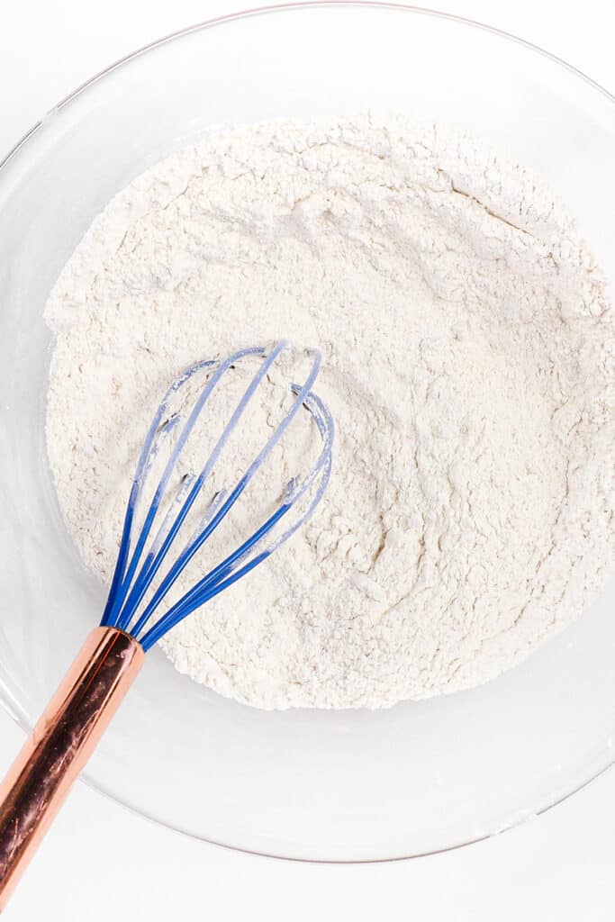 the dry ingredients for Lemon Curd Cake mixed together in a glass bowl