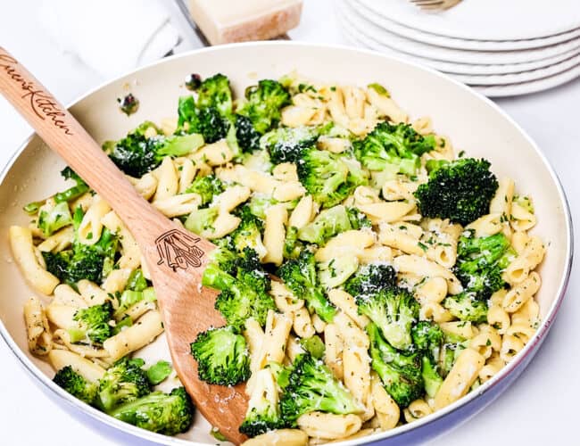 a serving spoon in a big pan of Cavatelli and Broccoli