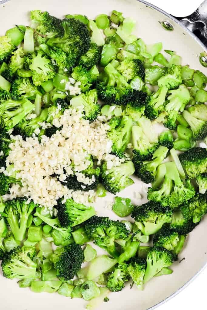 the garlic added to the pan with the broccoli