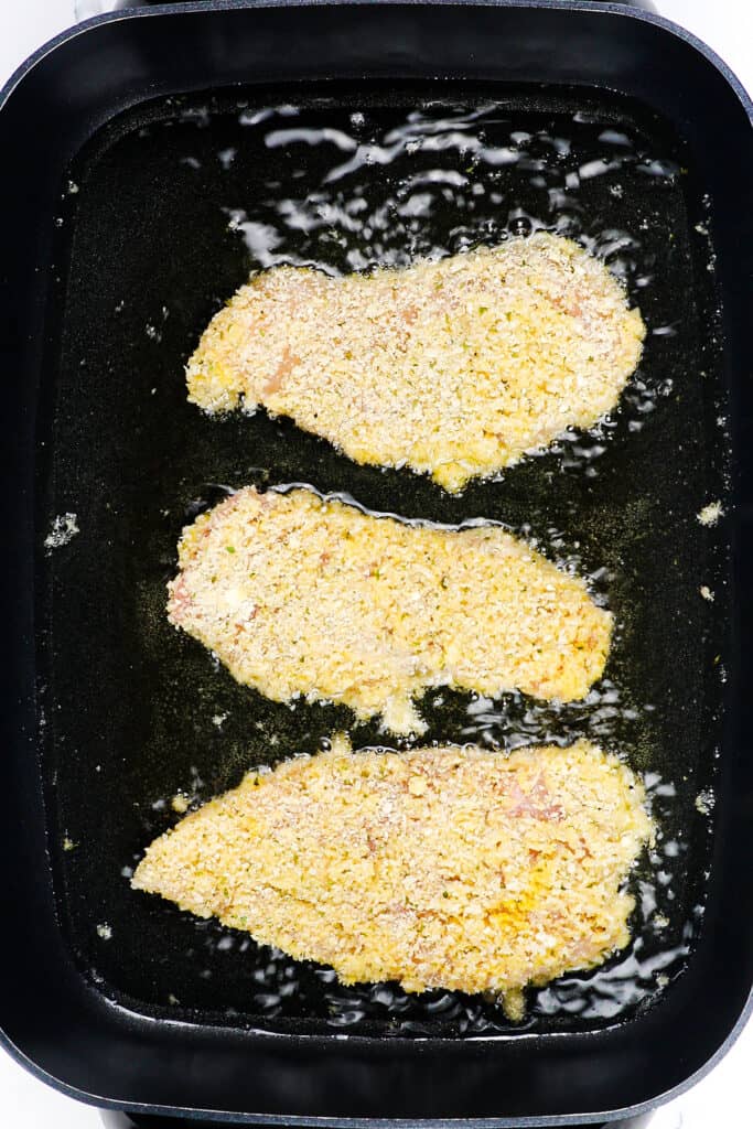 the breaded panko chicken cooking in oil