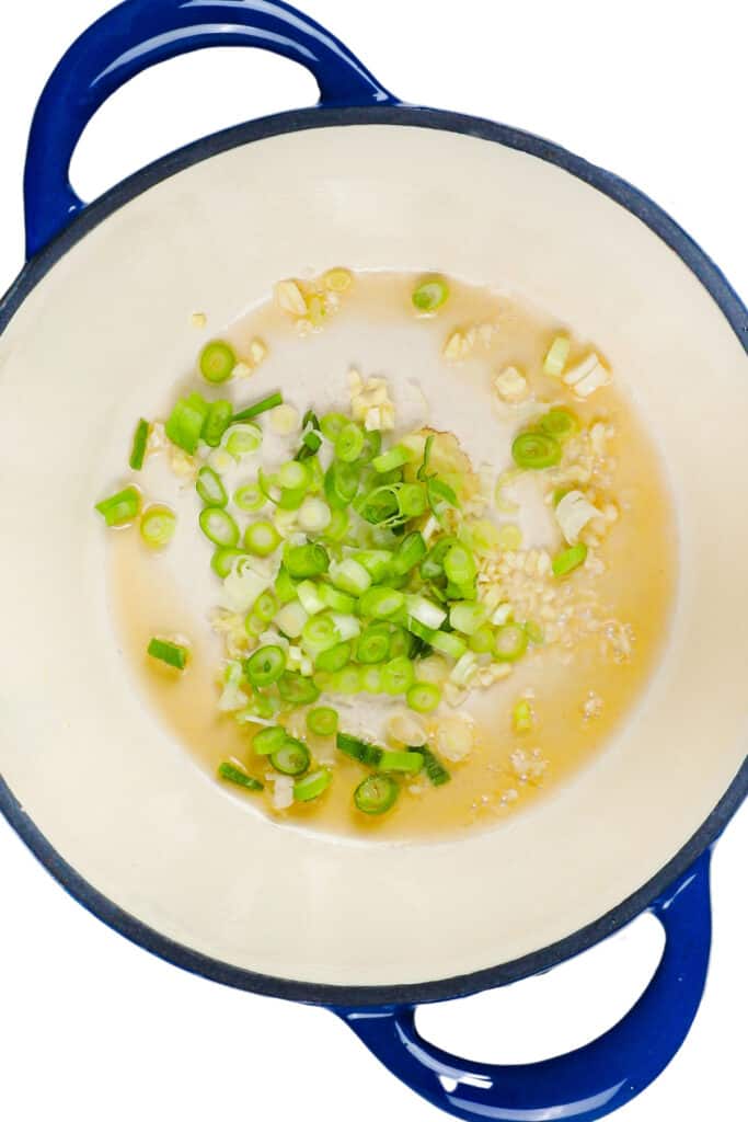 garlic, ginger, and scallions cooking in sesame oil