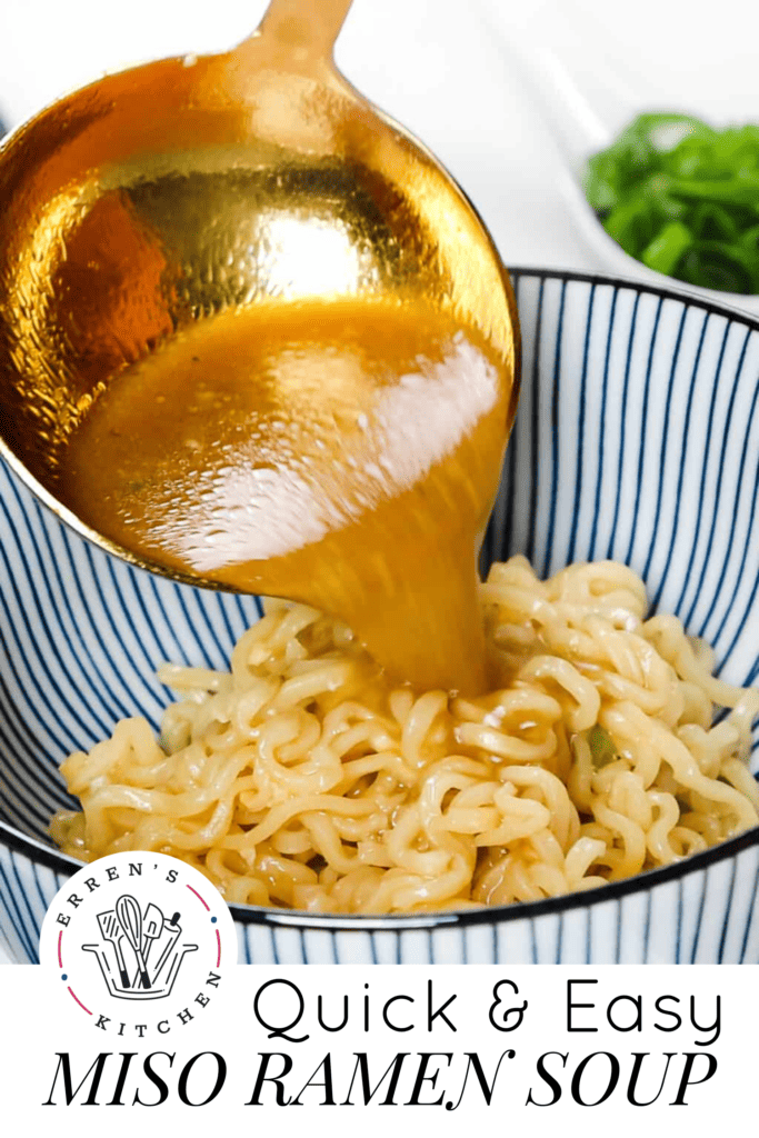 Miso broth being poured into a bowl of ramen noodles with a gold ladle.