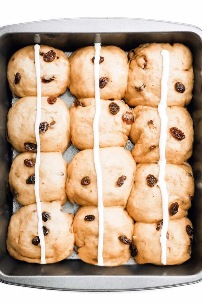a line piped down the middle of each row of buns in the pan