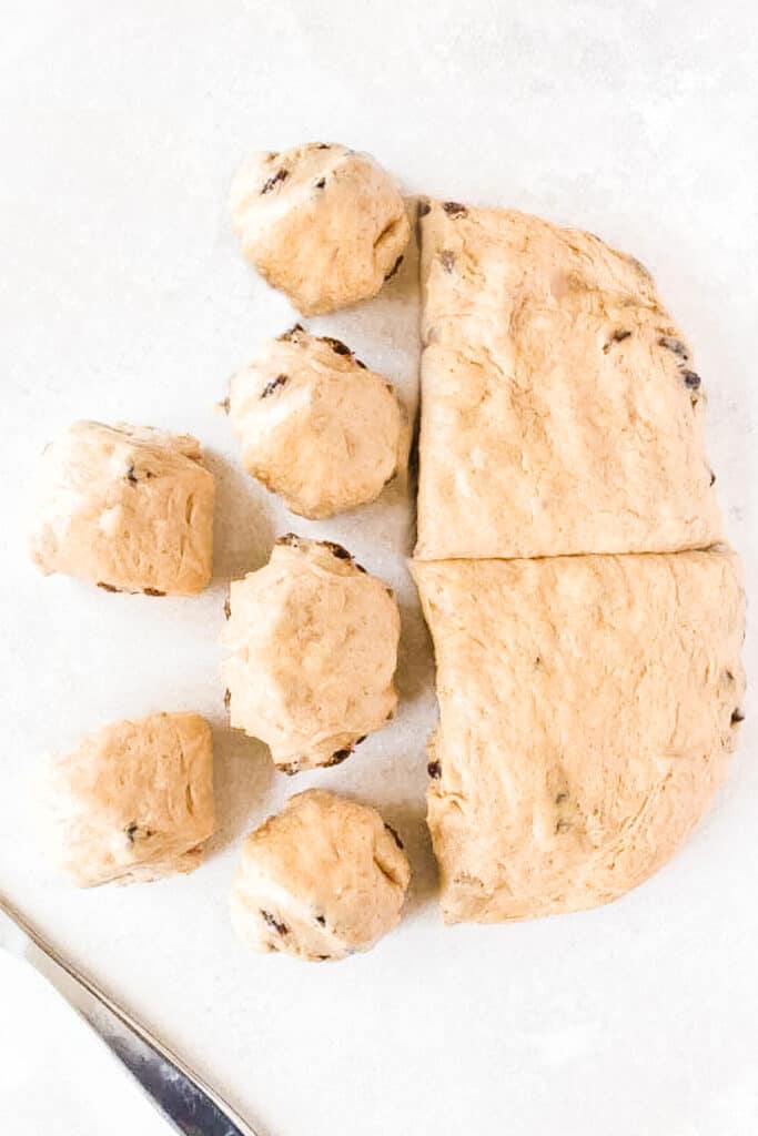 the dough cut with some of the sections rolled into balls