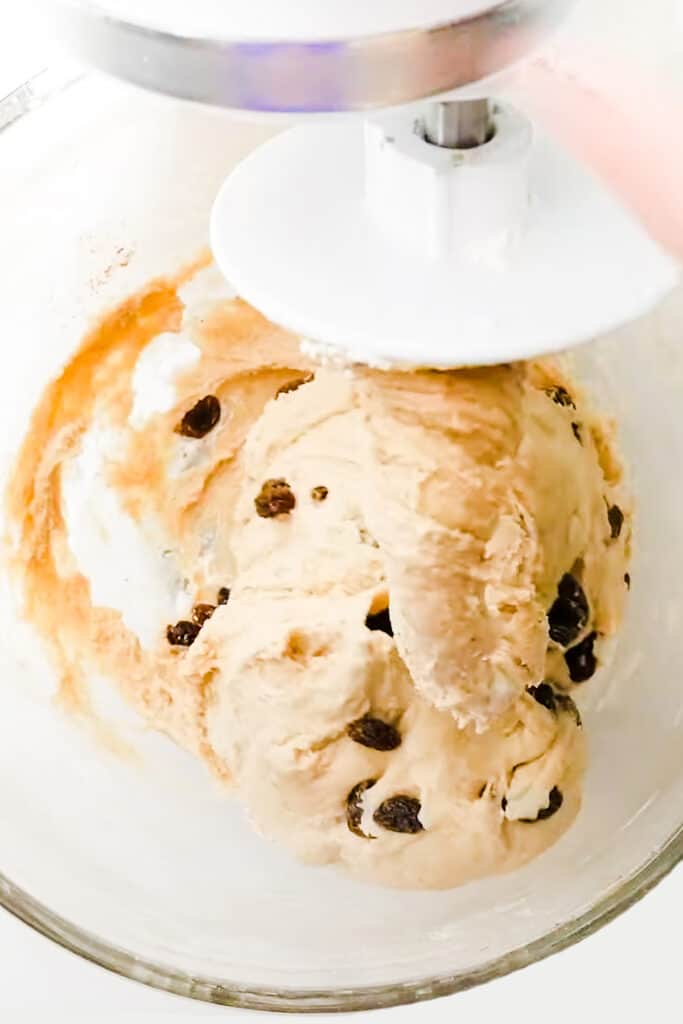 The dough on a dough hook in a mixer