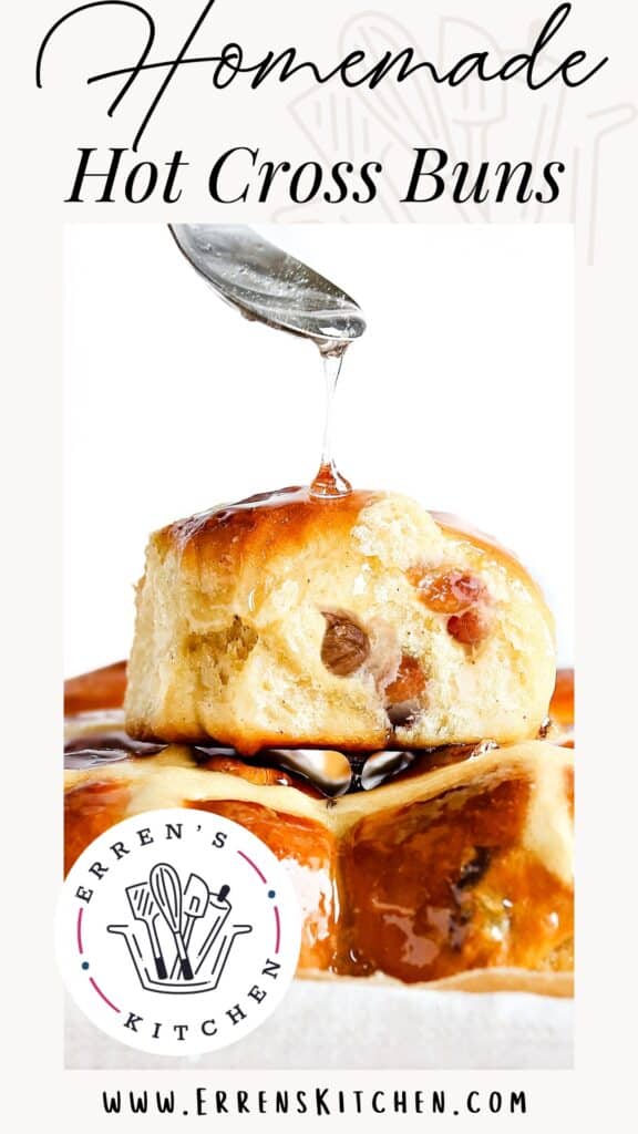 a Pinterest pin showing a clear glaze being spooned onto a pile of fresh Hot Cross Buns