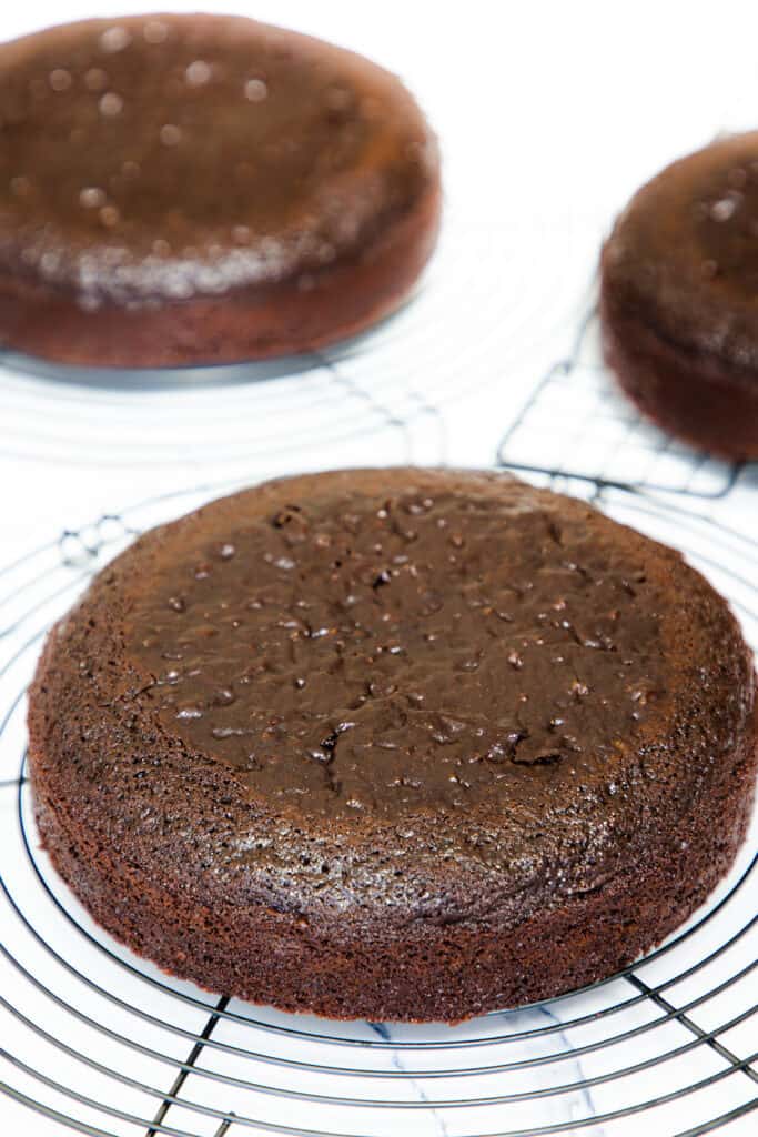 the cakes cooling on cooling racks