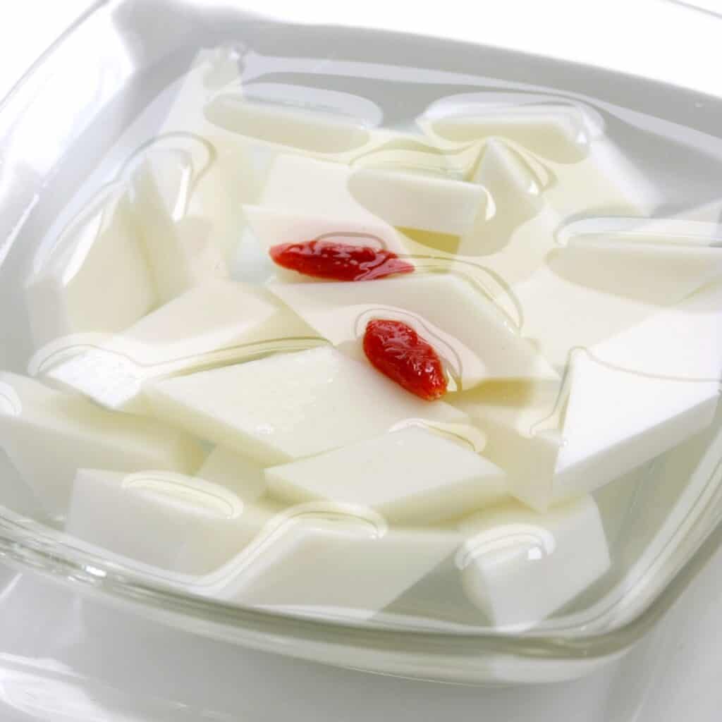 Xingren Doufu in a clear glass bowl