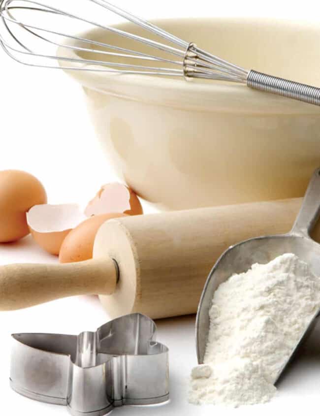 a selection of baking utensils and ingredients on a table