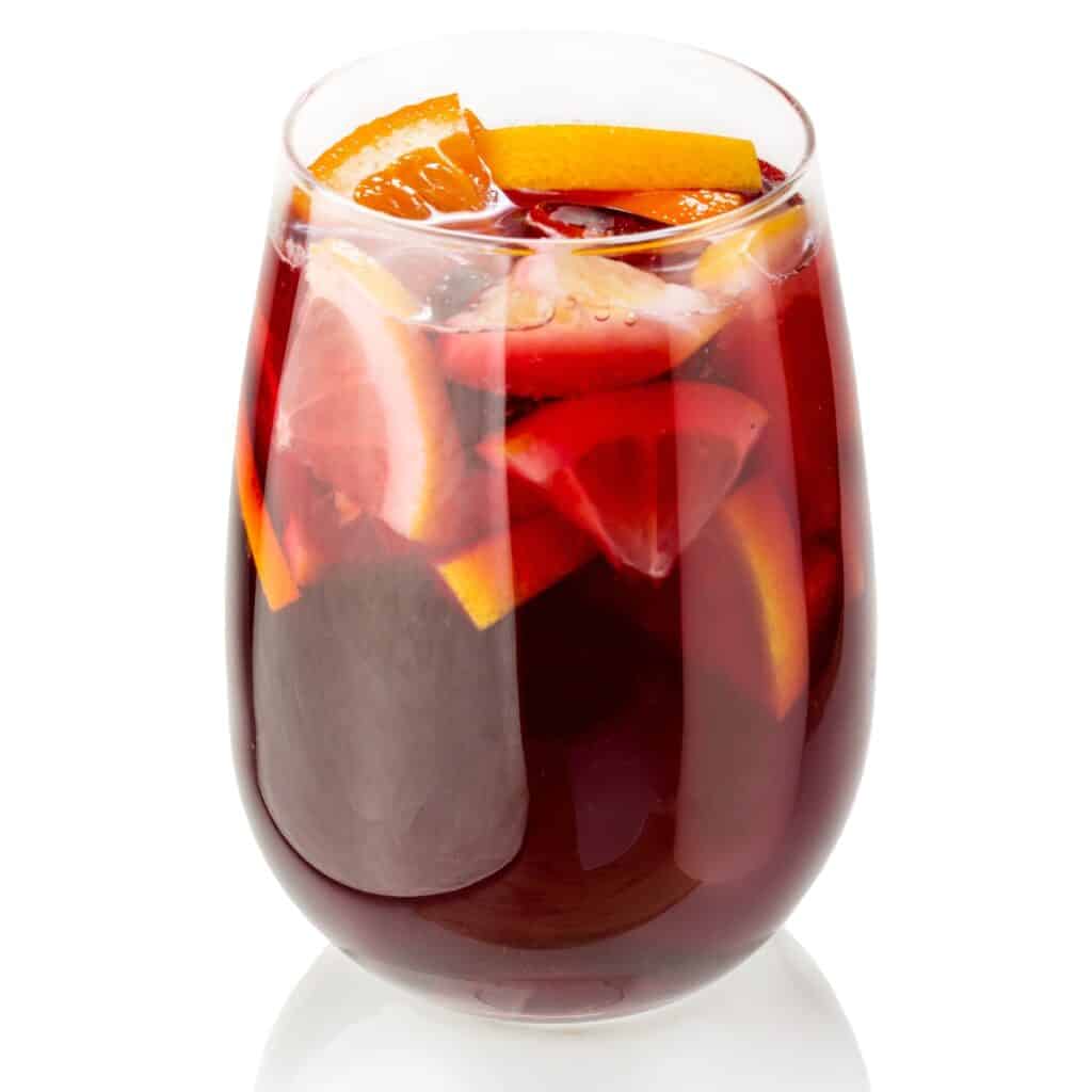 a glass of xalapa punch with oranges in the glass
