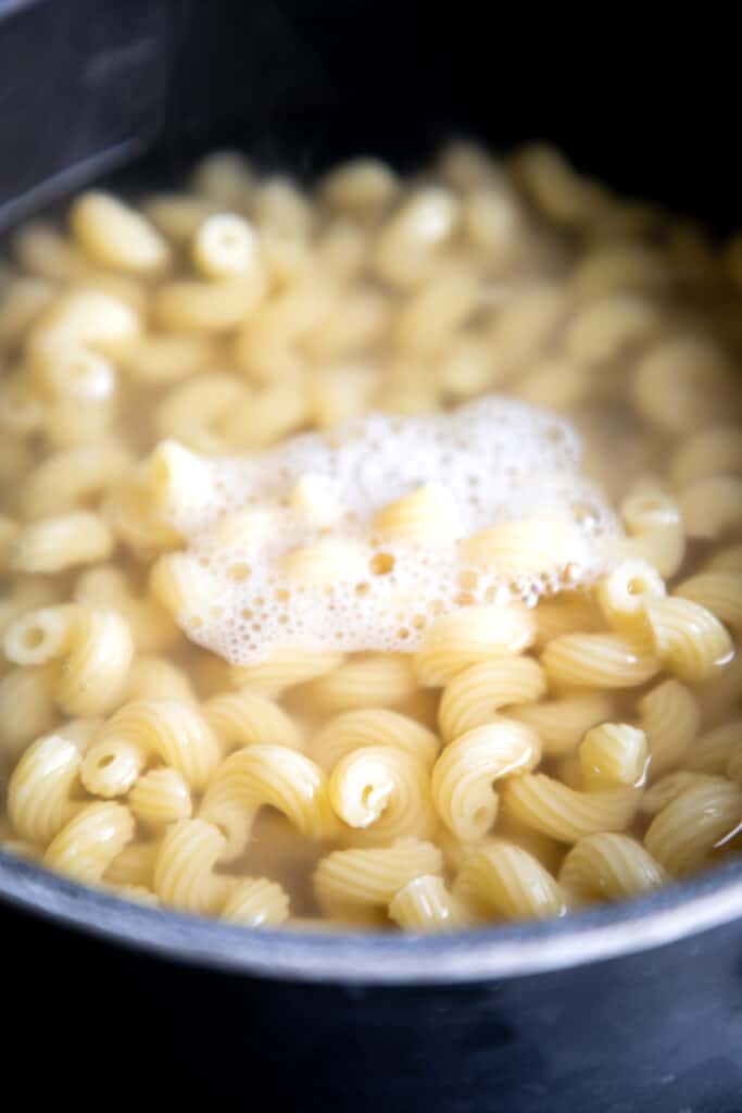 Macaroni cooking in boiling water