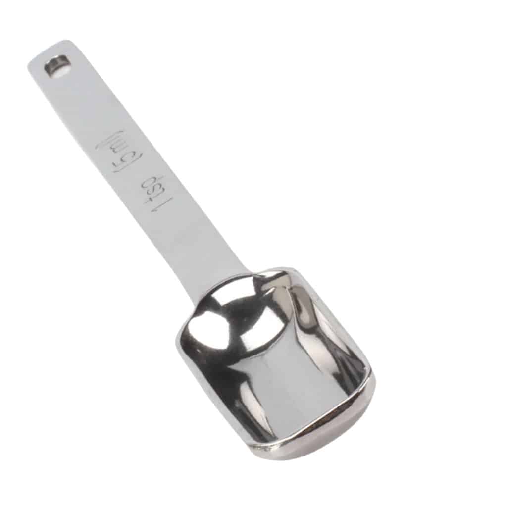 a stainless steel teaspoon measuring spoon with a white background