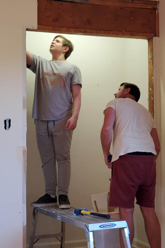 Father and son doing home improvements.
