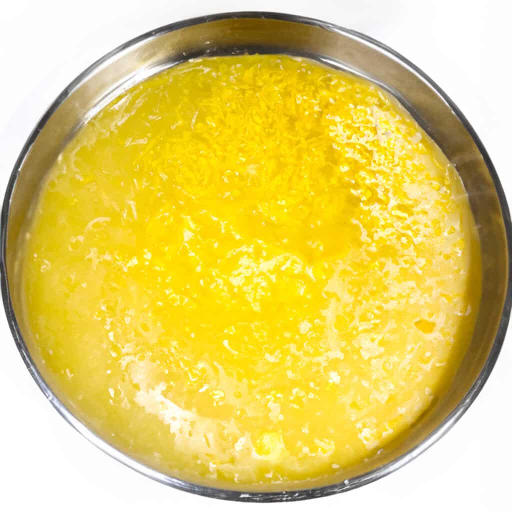 the lemon juice and egg mixture in a metal mixing bowl.