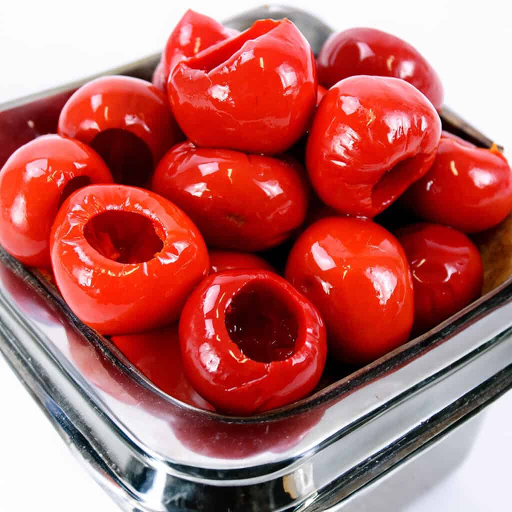 a bowl of cherry peppers that have been drained.