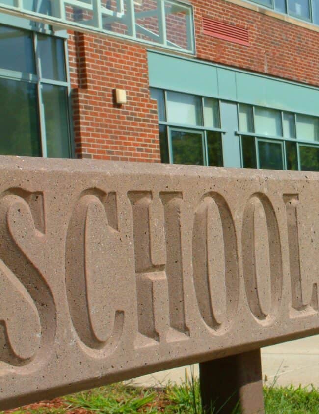 a school sign outside a building