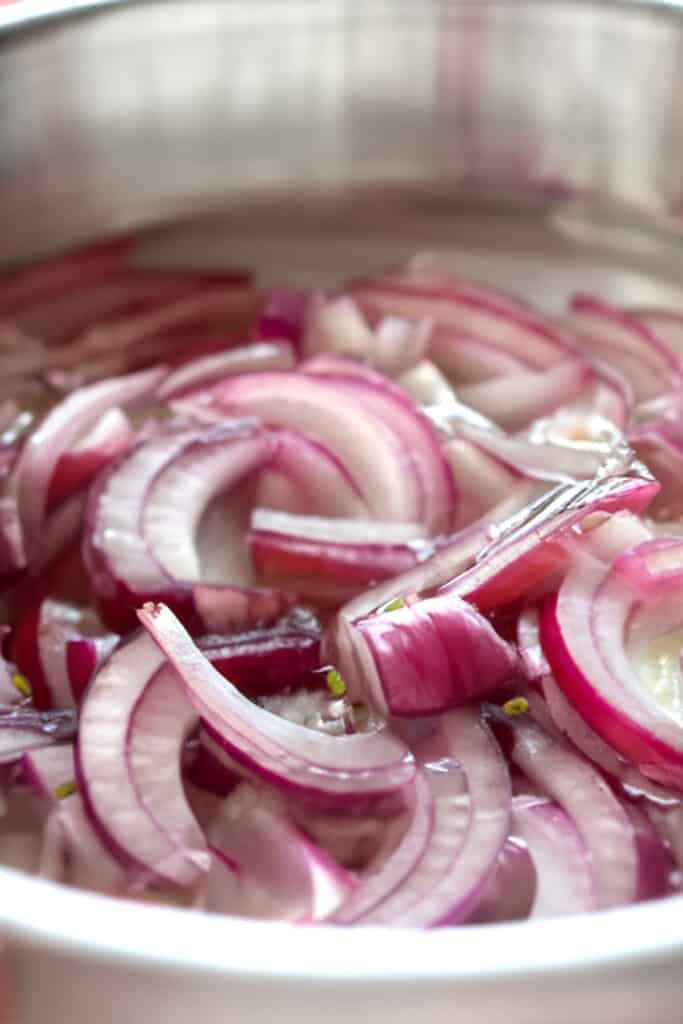 red onion soaking in ice water
