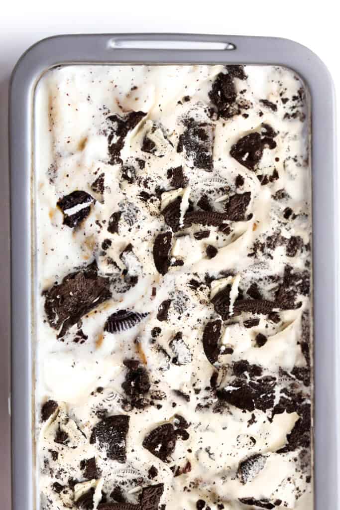 a loaf pan full of cookies and cream ice cream.