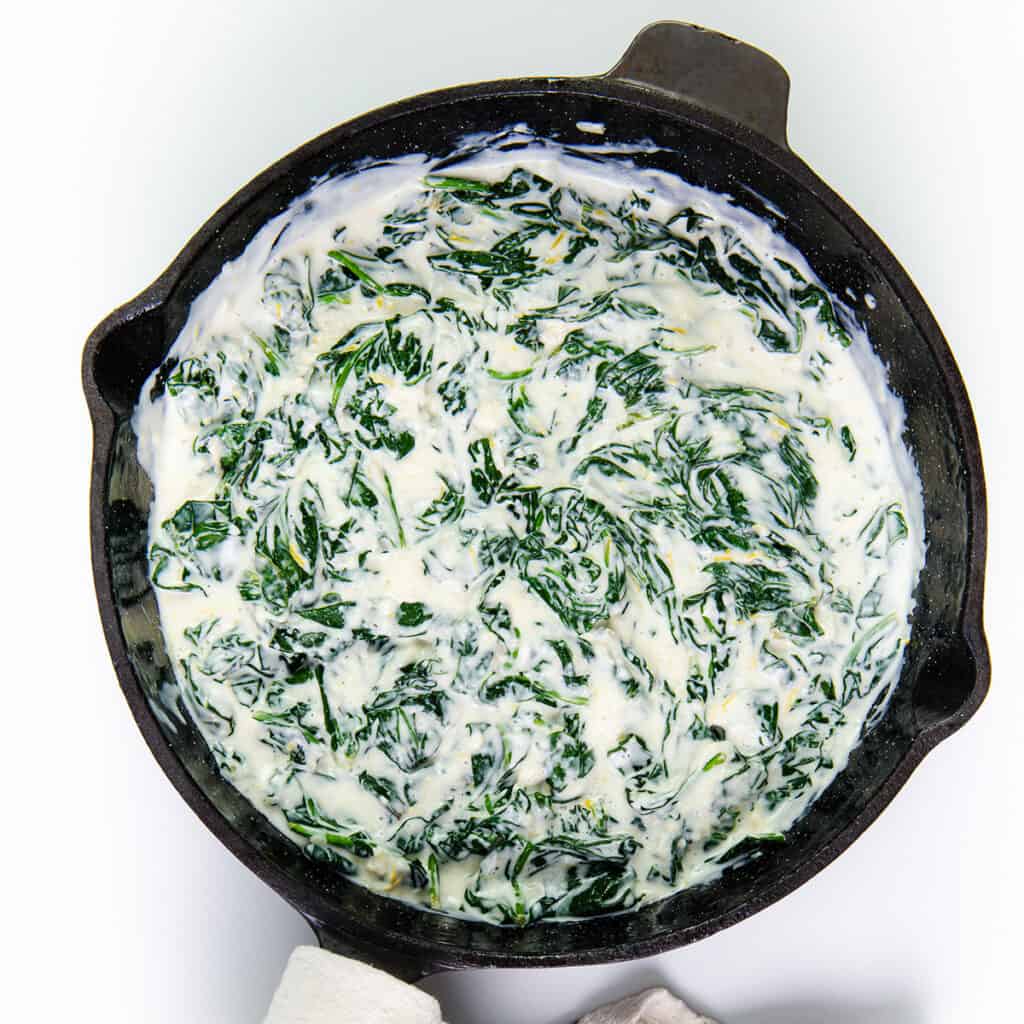 the creamy spinach mixture in the pan.