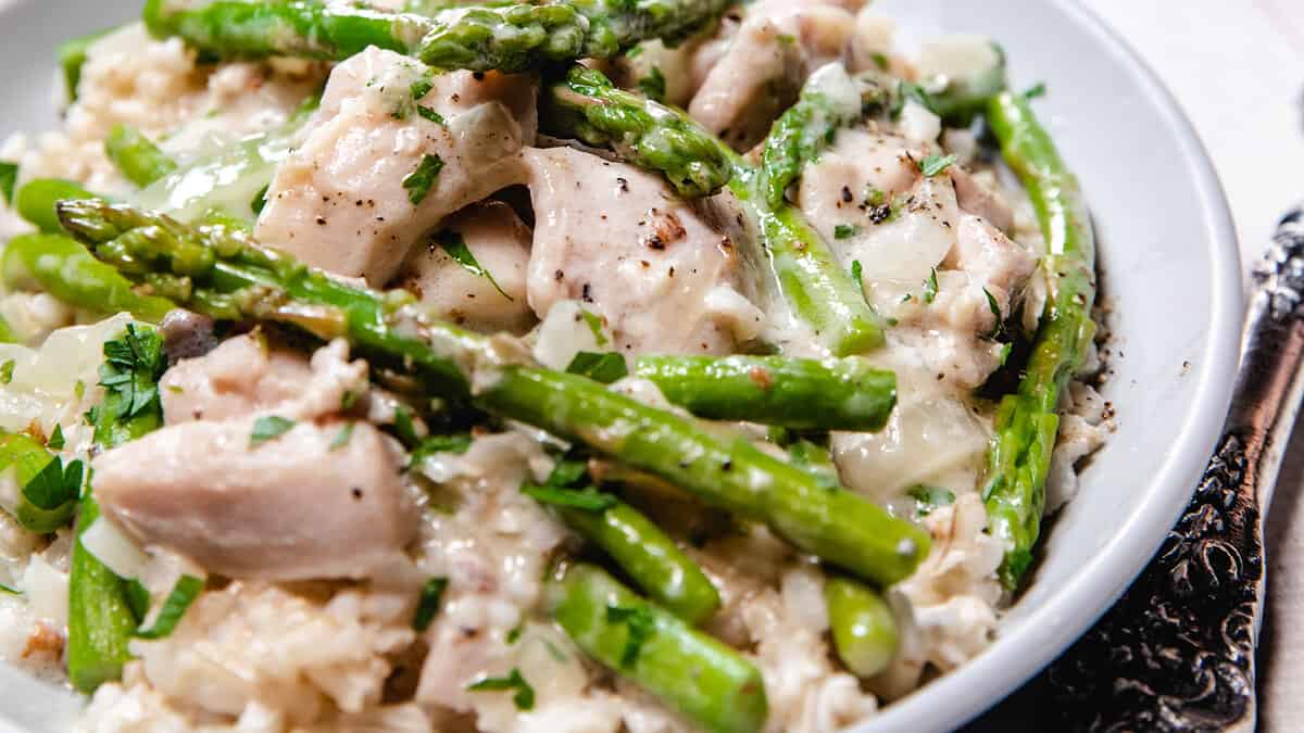 A bowl of Chicken and Asparagus in a cream sauce.