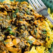 Sag Bahji {Spinach Curry} served over rice in bowl