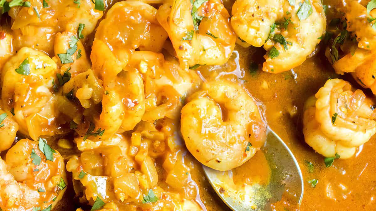 Shrimp Curry in the pan with a serving spoon ready to serve