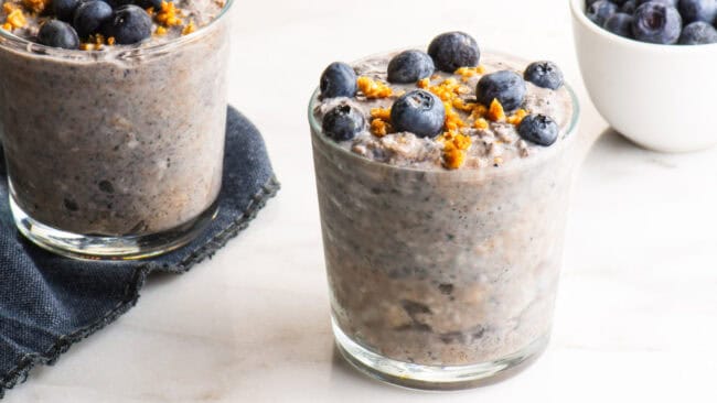 Jars of overnight oats with blueberries.