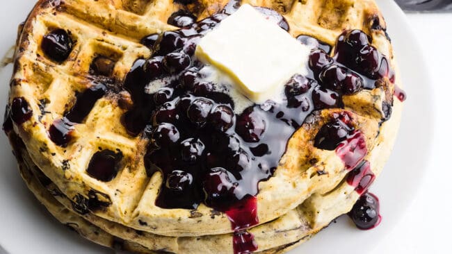 Blueberry waffles with blueberry sauce.