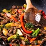 a close up image of a steak stir fry in a wok.