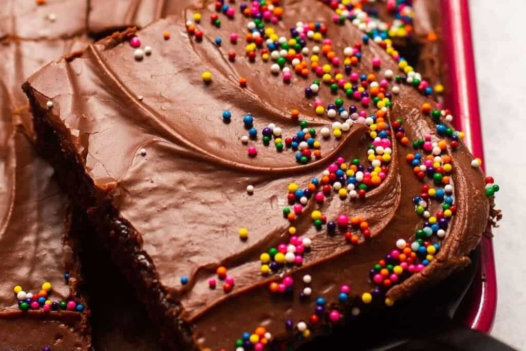 A close up image of Easy Chocolate Sheet Cake With Fudge Frosting.