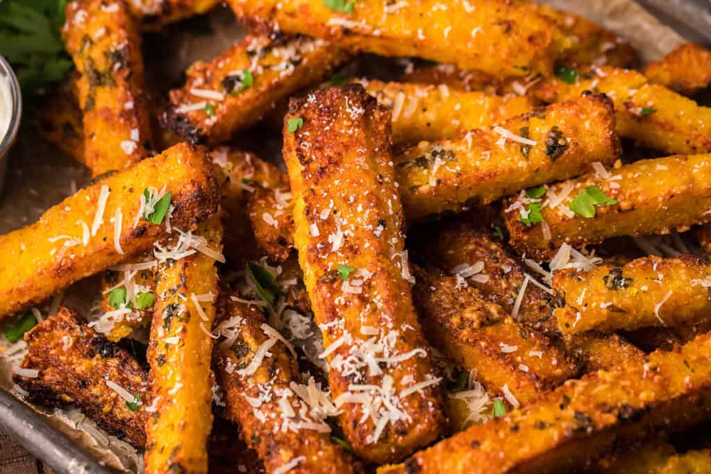 A close up image if a platter of Parmesan Truffle Polenta Fries.