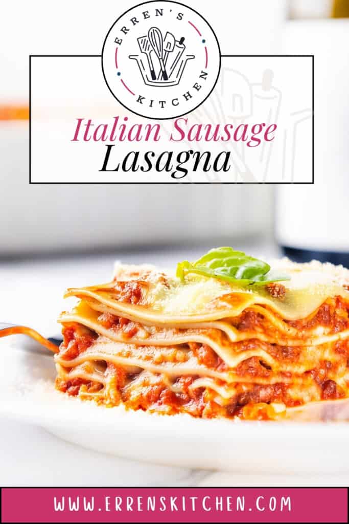 A close-up of a slice of Italian Sausage Lasagna on a white plate, garnished with fresh basil. The delicious layers and rich aroma invite savory indulgence. The softly blurred background enhances the focus, while the top showcases branding for Erren's Kitchen and a website URL.