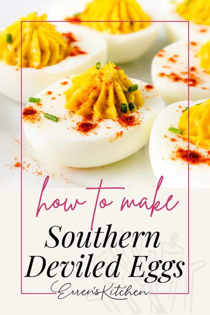 Close-up of classic Southern deviled eggs crowned with paprika and chives. A text overlay reads "How to make Deviled Eggs - Erren's Kitchen." These delectable eggs are beautifully arranged on a pristine white dish.