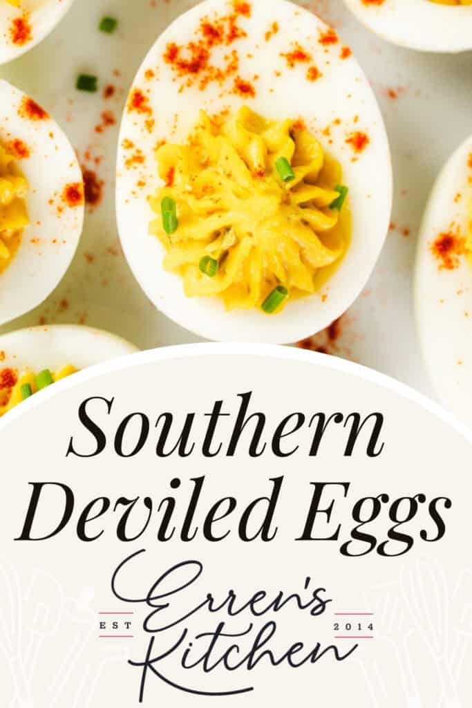 Close-up of Southern Deviled Eggs sprinkled with paprika and chopped chives on a white plate. Text on image reads: "Deviled Eggs - Erren's Kitchen EST 2014.