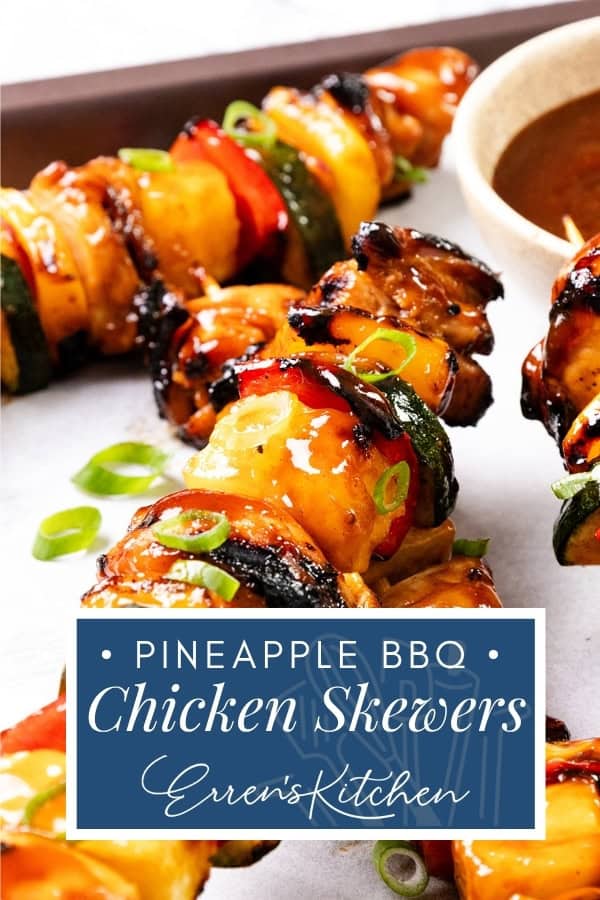 Grilled BBQ Chicken skewers with pineapple, zucchini, and bell peppers, topped with BBQ sauce and green onions, served with a bowl of dipping sauce. Text reads: "Pineapple BBQ Chicken Skewers, Erren's Kitchen.