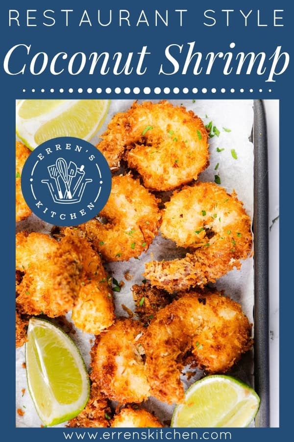 A tray of golden, crispy coconut shrimp garnished with chopped herbs and served with lime wedges and a sweet chili dipping sauce, displayed on parchment paper with the label "Restaurant Style Coconut Shrimp" and the Erren's Kitchen logo.