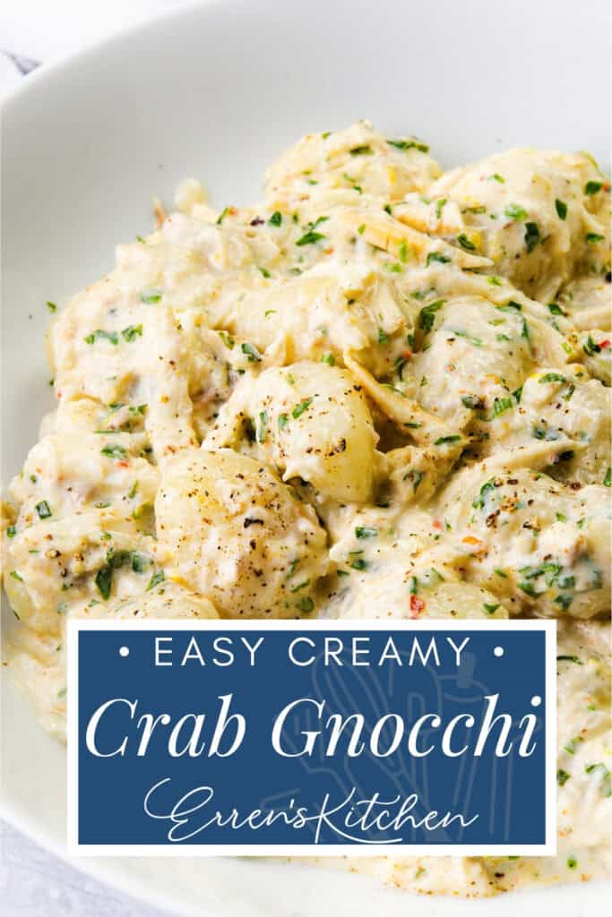 A white bowl filled with creamy crab gnocchi, garnished with fresh herbs and black pepper. Text overlay reads: "Easy Creamy Crab Gnocchi, Erren's Kitchen.