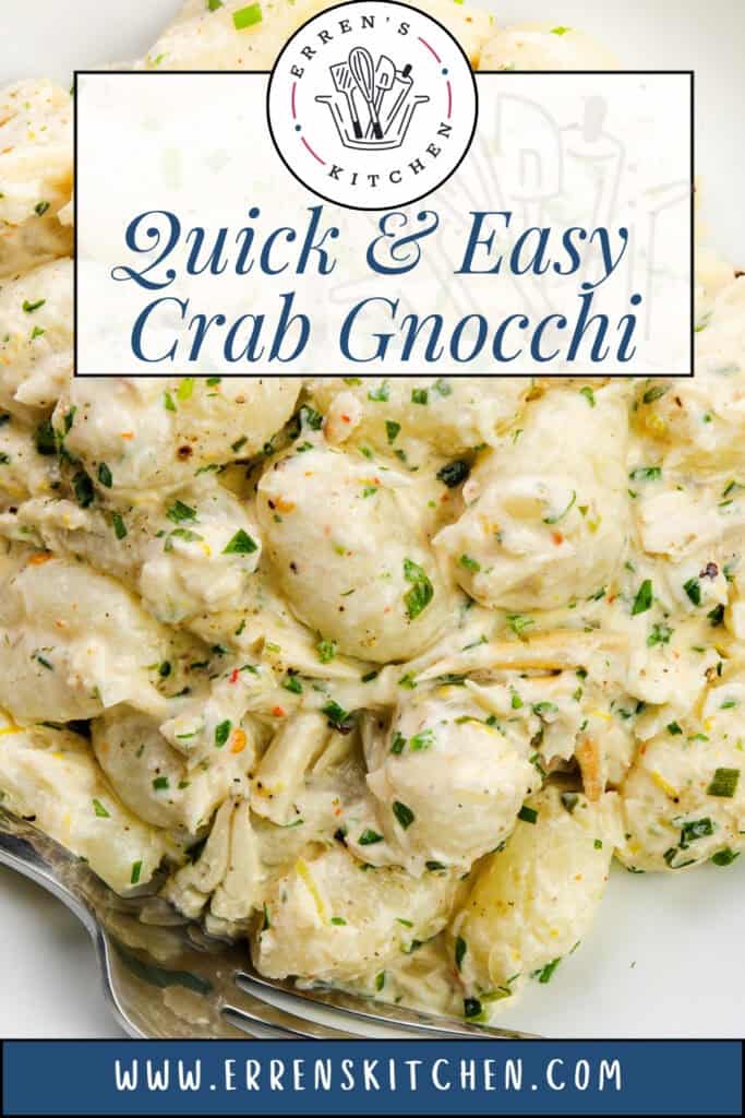 A close-up of creamy gnocchi with tender crab, garnished with chopped herbs and a serving spoon nearby. Text overlay reads "Quick & Easy Creamy Crab Gnocchi" and "www.errenskitchen.com".
