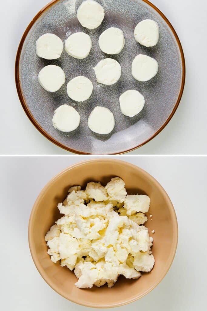 A bowl filled with crumbled white cheese, set against a plain white background.