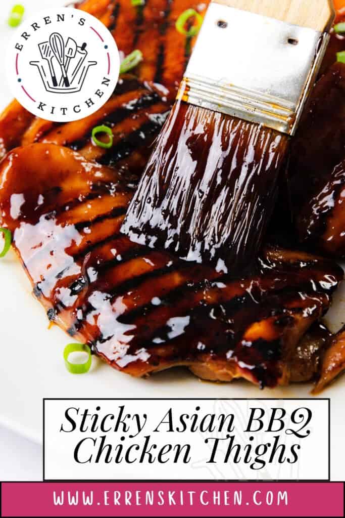 A close-up of Sticky Asian BBQ Chicken Thighs being brushed with a glossy, sticky sauce and garnished with sliced green onions. The image showcases this delicious recipe, featured on errenskitchen.com.