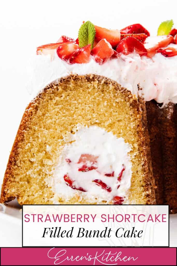 A slice of Strawberry Shortcake Filled Cake with a creamy strawberry filling and whipped topping, garnished with fresh strawberry pieces and mint. Text overlay reads: "Strawberry Shortcake Filled Bundt Cake - Erren's Kitchen.