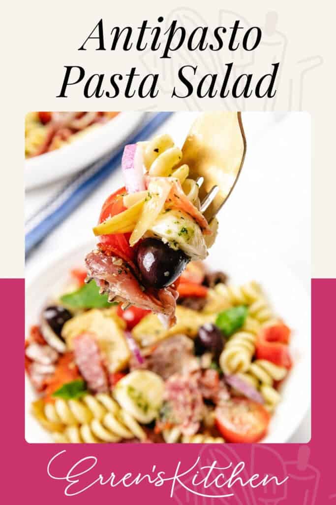 A fork holds a bite of Italian Antipasto Pasta Salad with pasta, olives, salami, tomato, and onion above a bowl filled with more colorful salad. Text reads "Antipasto Pasta Salad" and "Erren's Kitchen.