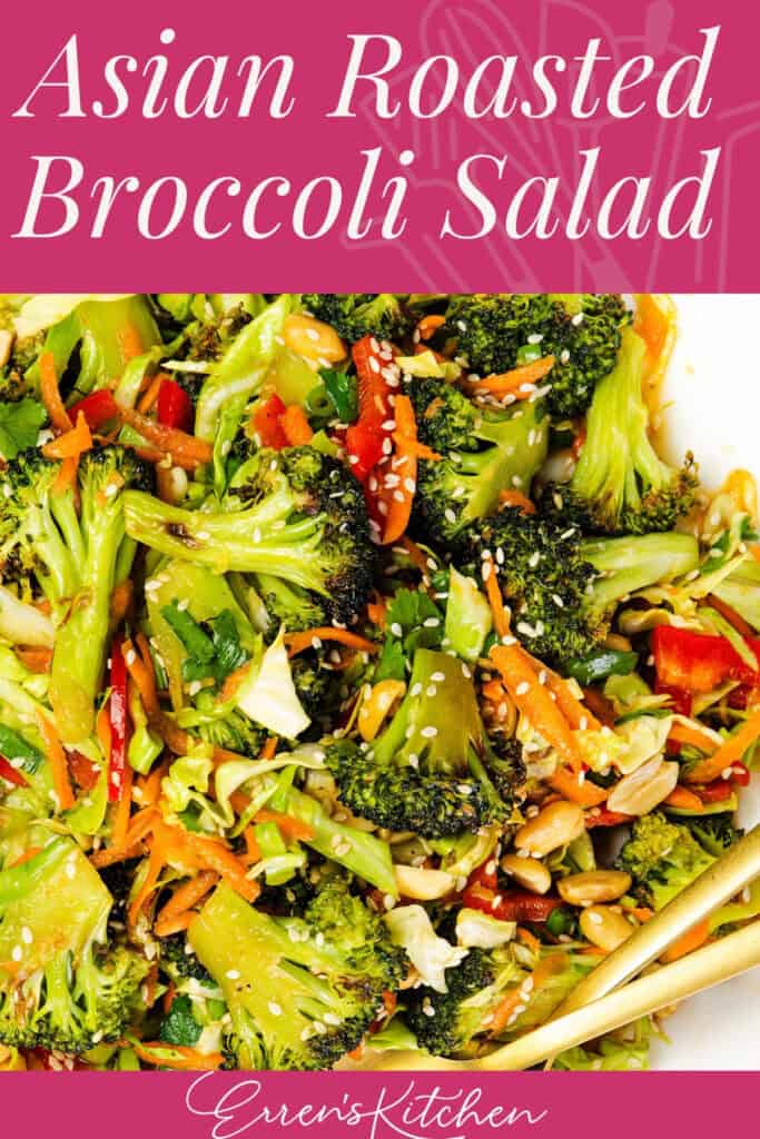 A close-up of roasted broccoli salad with broccoli florets, shredded carrots, red bell peppers, green onions, and sesame seeds. The text reads “Asian Roasted Broccoli Salad” and “Eren’s Kitchen.”.