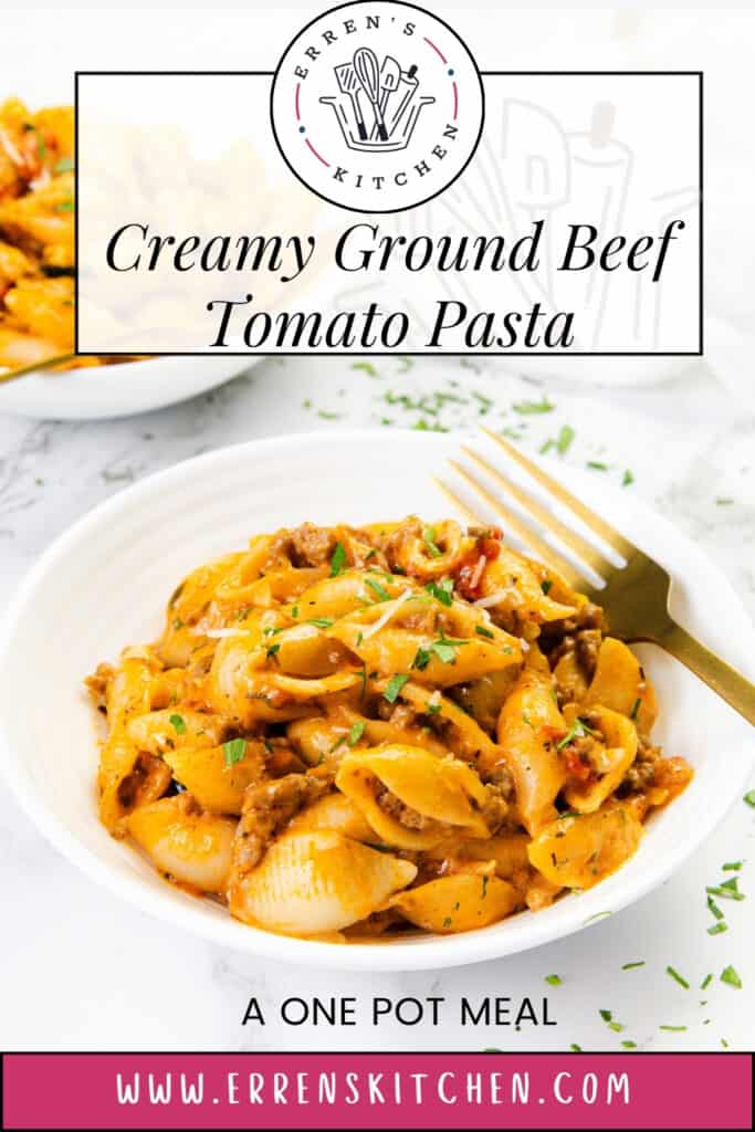 A white bowl filled with creamy tomato pasta and ground beef, topped with chopped herbs, with a gold fork resting inside. In the background, another bowl of one pot pasta is partially visible. Text overlays promote the recipe and website.