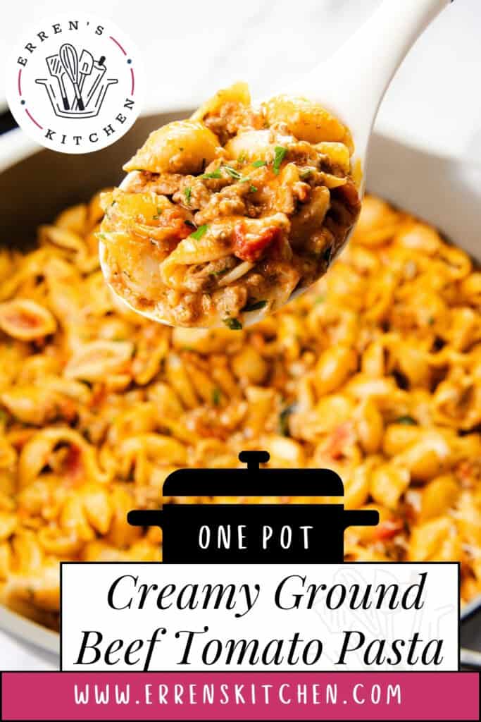 A white spoon lifts a serving of creamy tomato pasta from a pot. This one pot pasta features shell pasta, ground beef, tomato sauce, and herbs. Text reads "One Pot Creamy Ground Beef Tomato Pasta" and "www.errenskitchen.com.