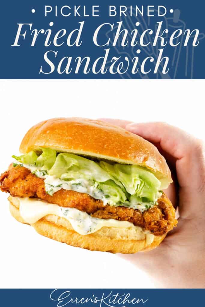A hand holds a pickle brined fried chicken sandwich stacked with lettuce, pickles, sauce, and a golden bun. Text above reads, "Pickle Brined: Fried Chicken Sandwich." "Erren's Kitchen" is written at the bottom.
