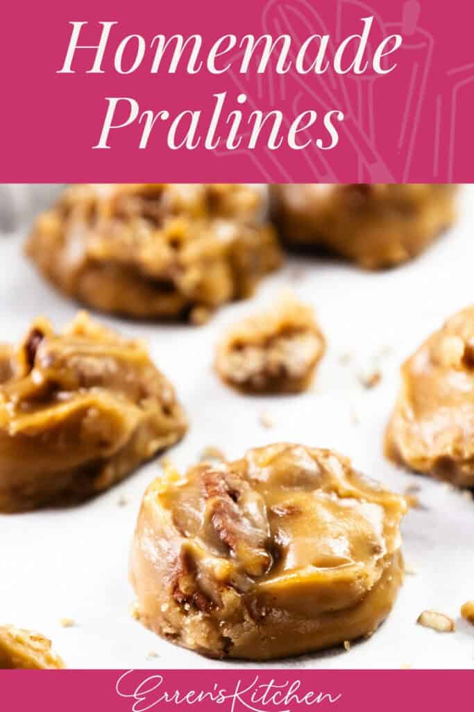 Close-up of homemade Southern Pralines with pecans on parchment paper, featuring text "Homemade Pralines" at the top and "Erren's Kitchen" at the bottom on a pink background.